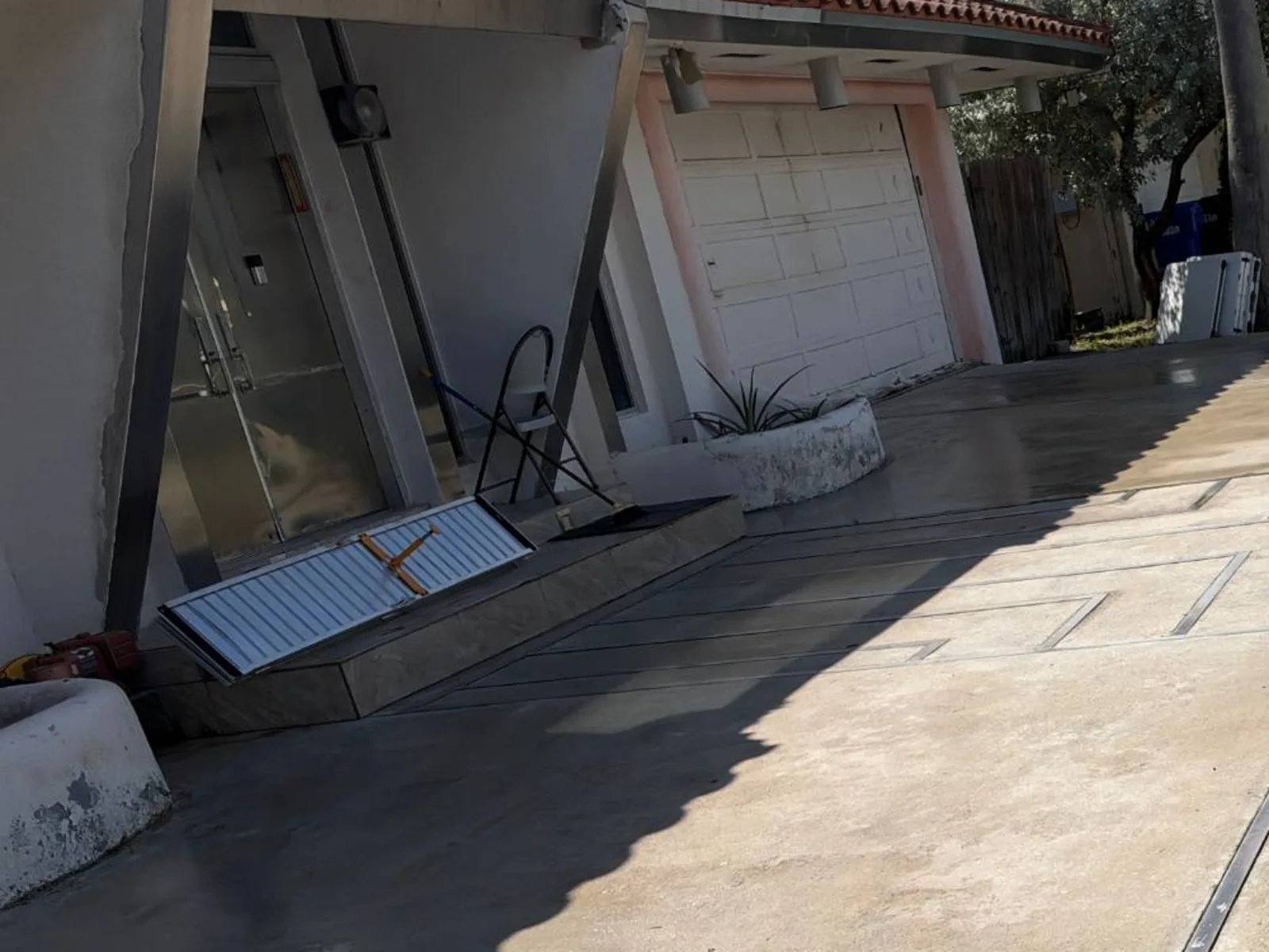 After: driveway by the garage door